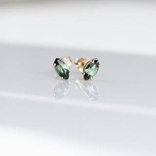 Marquise cut green sapphire earrings in solid gold quarter view 