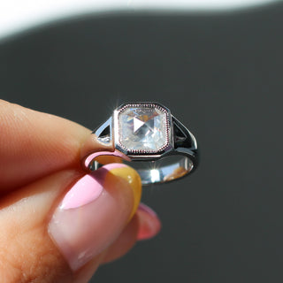 Custom ring with ethically sourced solitaire diamond centre stone in a silver setting, handcrafted by Yuliya Chorna at her Toronto studio.