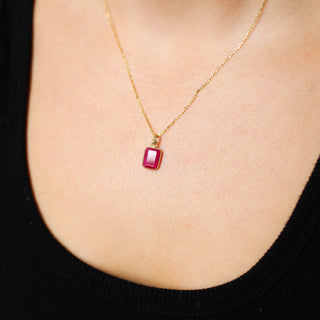Large Ruby Bezel Charm being worn on a paper clip chain front view