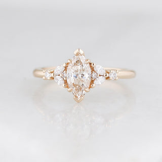 Marquise champagne coloured diamond ring on grey background 