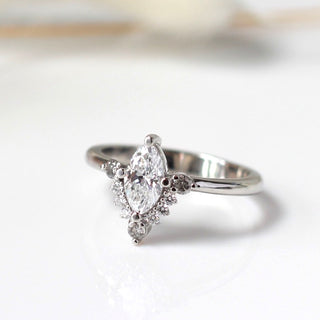Custom engagement ring with ethically sourced marquise diamond centre stone in a platinum setting, handcrafted by Yuliya Chorna at her Toronto studio.