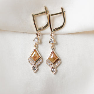 Custom mixed gemstone earrings handcrafted by Yuliya Chorna at her Toronto studio.