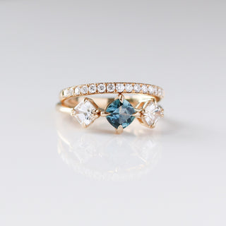 Blue Cushion Cut Montana Sapphire Three Stone Ring paired with diamond gold band  detailed front view