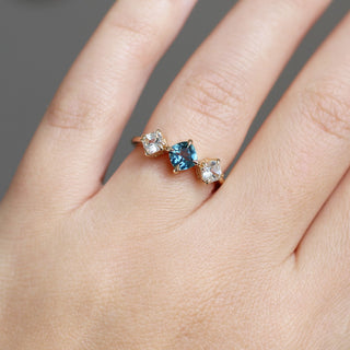Blue Cushion Cut Montana Sapphire Three Stone Ring being worn on hand