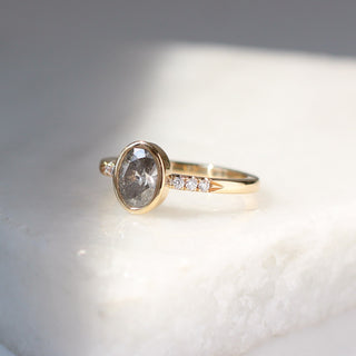 Oval salt and pepper diamond ring three quarter view