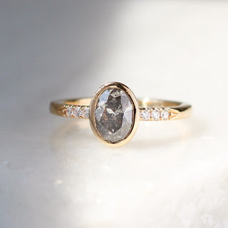 Oval bezel set salt and pepper diamond ring