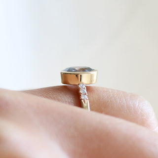 Oval salt and pepper diamond ring side view on hand