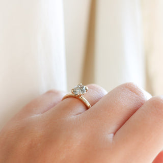 Oval cut champagne sapphire ring in yellow gold on hand side view