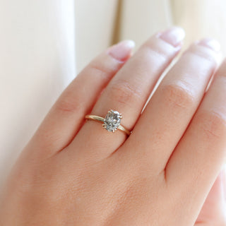 Oval cut champagne sapphire ring in yellow gold on hand