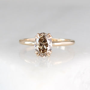 Oval cut yellow sapphire ring in yellow gold fron view