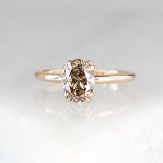 Oval cut champagne sapphire ring in yellow gold front view