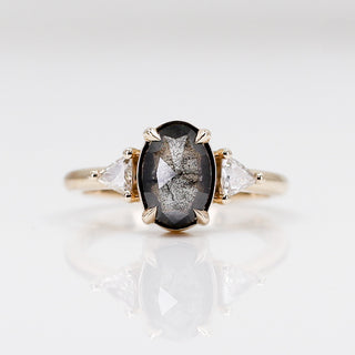 Custom engagement ring with ethically sourced oval balck diamond centre stone in a gold setting, handcrafted by Yuliya Chorna at her Toronto studio.