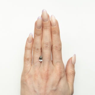 Pear brilliant cut mint green sapphire on hand