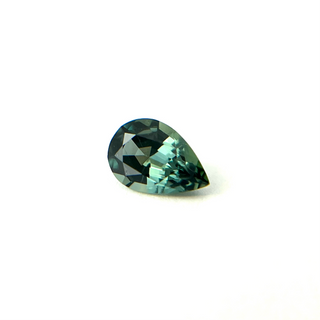 Pear cut teal green sapphire on side