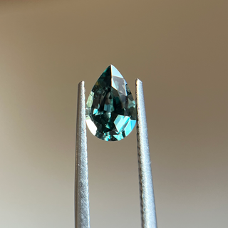 Pear cut teal green sapphire tweezers