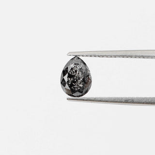 Pear shaped salt and pepper diamond front view in tongs