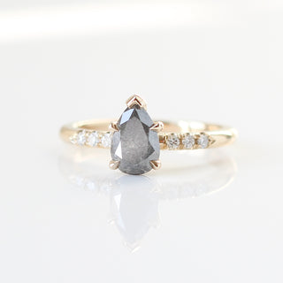 Custom engagement ring with ethically sourced centre stone in a diamond studded gold setting, handcrafted by Yuliya Chorna at her Toronto studio.