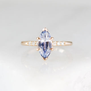 Marquise blue sapphire engagement ring in yellow gold, front view