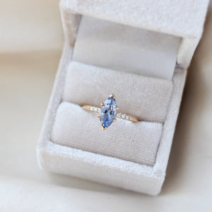 Marquise blue sapphire engagement ring in ring box