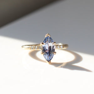 Marquise blue sapphire engagement ring in sunlight