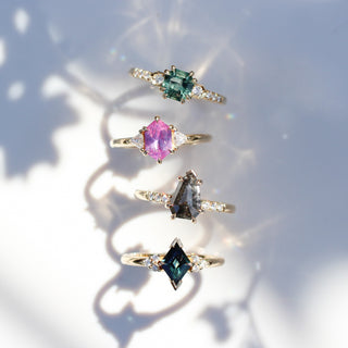 Precious stone gold rings in sunlight