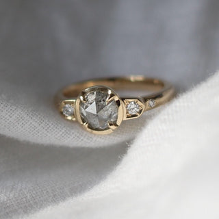 Custom round claw engagement ring with ethically sourced icy diamond centre stone in a gold setting, handcrafted by Yuliya Chorna at her Toronto studio.
