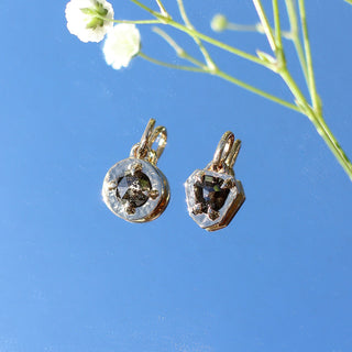 Round Rustic Diamond Pendant in group with rustic diamond pendant on mirror with flowers