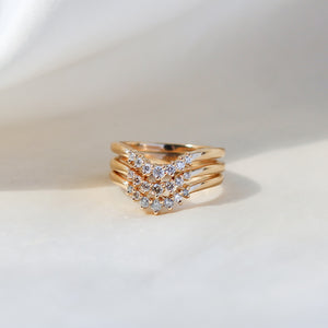 Grey Diamond stacking band paired with 2 diamond stackinbg bands in yellow gold quarter view