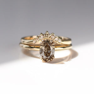Grey Diamond band in yellow gold stacked with oval diamond in yellow gold front view