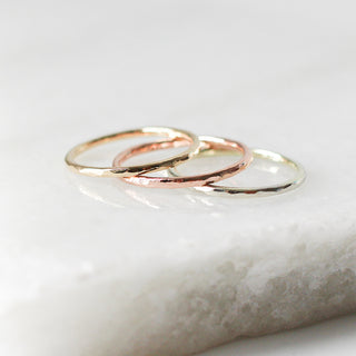 Set of three thin hammered bands on marble