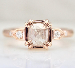 Custom engagement ring with ethically sourced ice diamond centre stone in a rose gold setting, handcrafted by Yuliya Chorna at her Toronto studio.