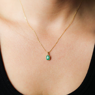 Small Emerald Bezel Charm being worn as a  necklace