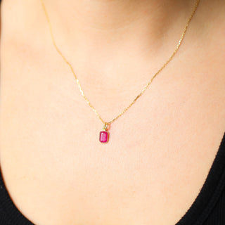Small Ruby Bezel Charm being worn as a necklace on paperclip chain