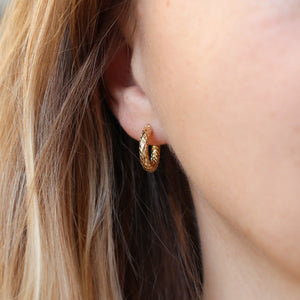 Diamond Cut Gold Hoop earrings on ear frornt view