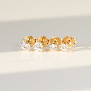 Round Diamond Stud Earrings in group quarter view
