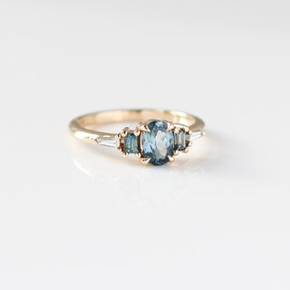 Yellow gold ring with blue sapphires, quarter view