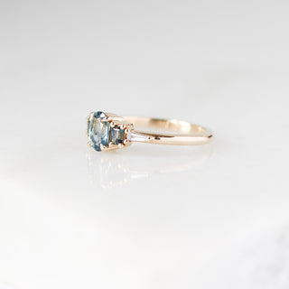 Yellow gold ring with blue sapphires, half view
