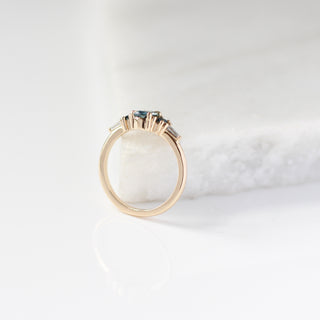 Yellow gold ring with blue sapphires, side view