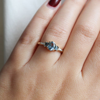 Yellow gold ring with blue sapphires, on hand