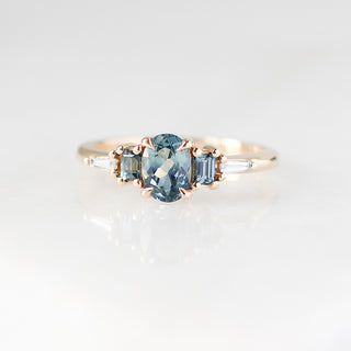 Yellow gold ring with blue sapphires, front view