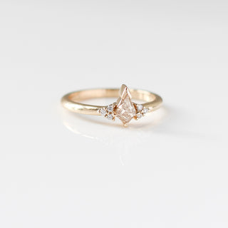Champagne kite cut diamond ring with white diamond accents, front view