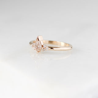 Champagne kite cut diamond ring with white diamond accents, quarter view