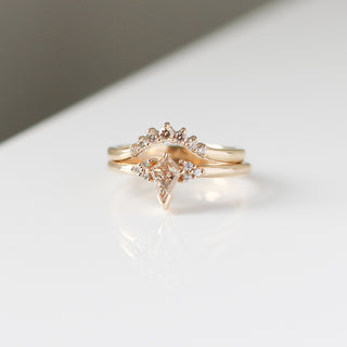 Champagne kite cut diamond ring with white diamond accents and a diamond contour band, front view