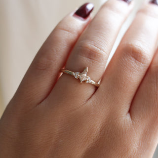 Champagne kite cut diamond ring with white diamond accents, on hand