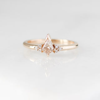 Champagne kite cut diamond ring with white diamond accents, front view