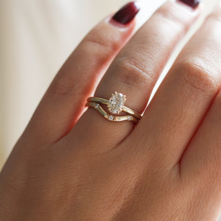 yellow gold diamond solitaire ring with contour band on hand