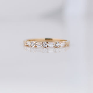 Yellow gold wedding band with baguette cut and round brilliant cut lab diamonds, front view