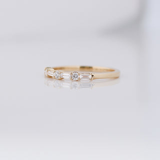 Yellow gold wedding band with baguette cut and round brilliant cut lab diamonds, quarter view