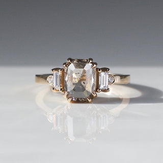 Emerald cut champagne diamond ring with baguette and round diamond side stones in yellow gold, front view