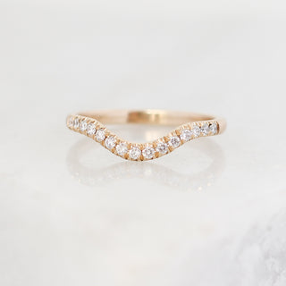 Diamond pave curved wedding band in yellow gold, front view